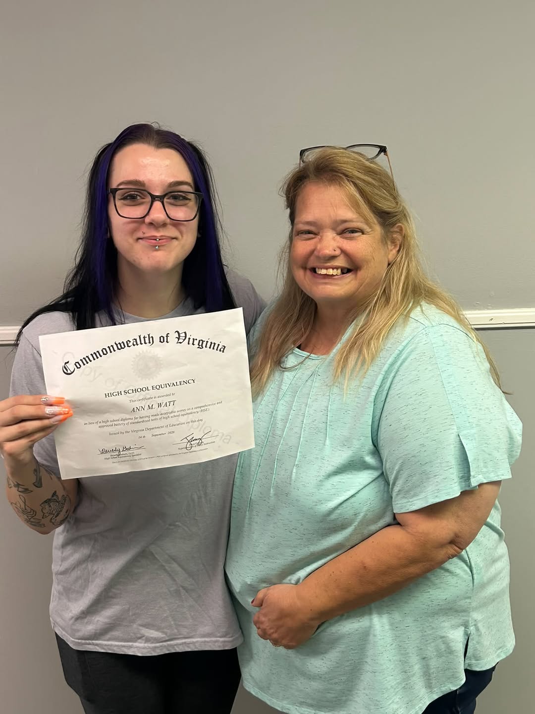 828925724_1397932049166791_8978727577275305083_n Ann holding her GeD with Cindy